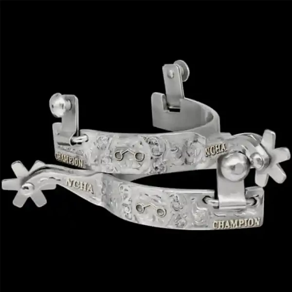 "Ride in style with the Wyatt Earp Custom Spurs. Crafted on high quality German Silver, this set of spurs is hand engraved on the entire outside and both sides of the shank. Detailed with Jewelers Bronze lettering on the outside band and shank as wel